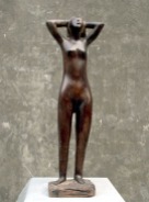 a_nude_woman_standing_wood_sculpture